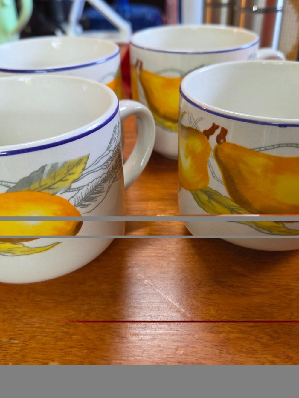 white ceramic cups with yellow pears and leaves set of four
